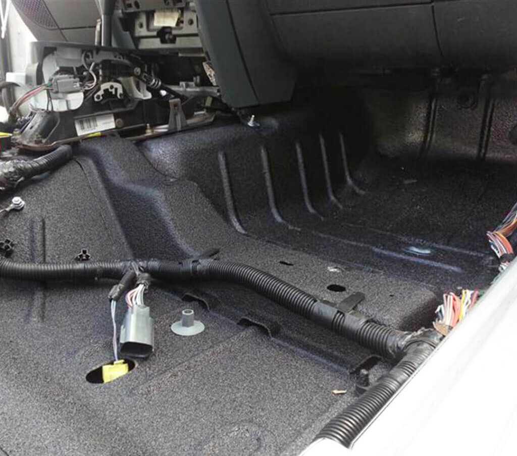 grey jeeps interior floor with armaguard bedliner on it